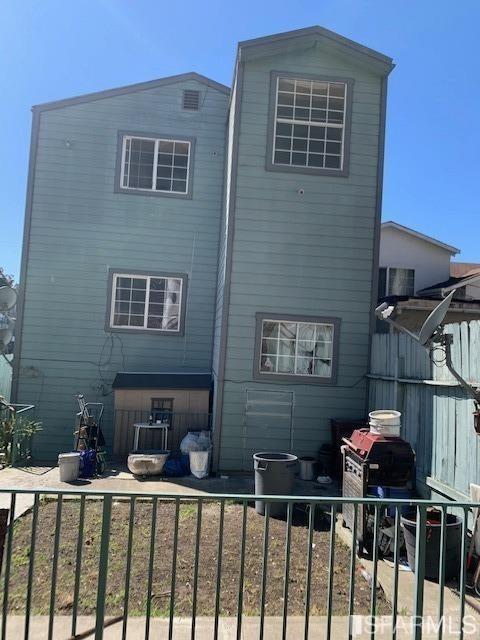 1326 Palou Ave, San Francisco, CA 94124 - rear view of house with fence