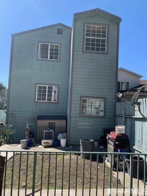 1326 Palou Ave, San Francisco, CA 94124 - rear view of house with fence