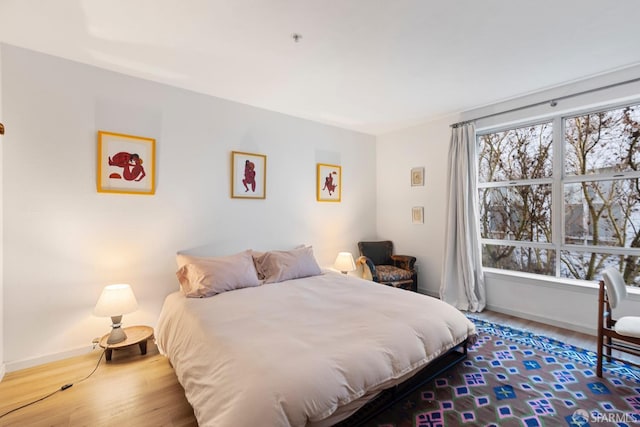 bedroom with wood-type flooring