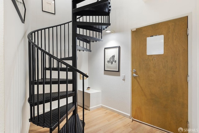 foyer entrance with hardwood / wood-style flooring