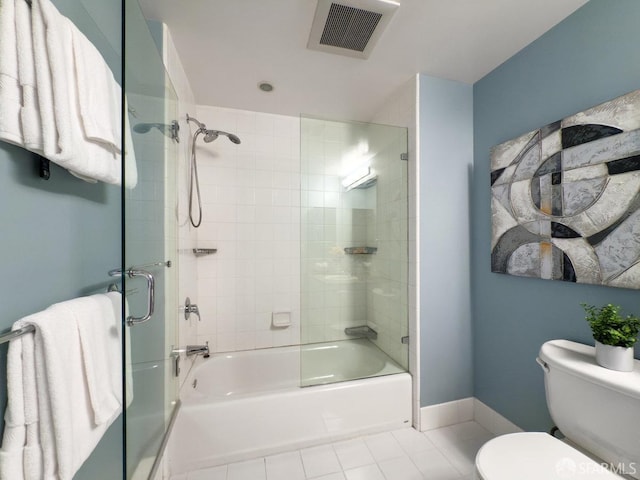 250 King St Unit 528, San Francisco, CA 94107 - full bath featuring tile patterned flooring, visible vents, toilet, and bath / shower combo with glass door