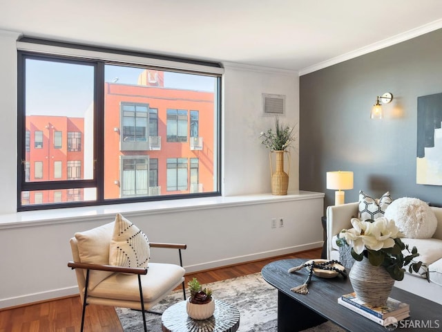 250 King St Unit 528, San Francisco, CA 94107 - sitting room featuring baseboards, wood finished floors, visible vents, and ornamental molding