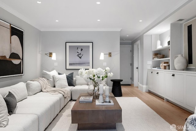 living area with light wood-style flooring, recessed lighting, baseboards, and ornamental molding