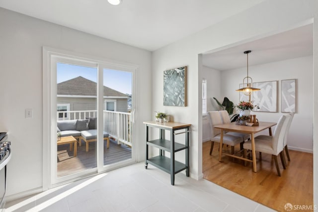 dining space featuring baseboards