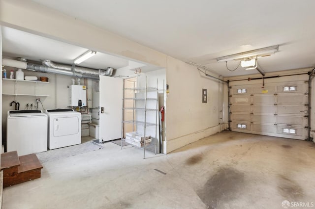 garage featuring water heater, a garage door opener, and separate washer and dryer