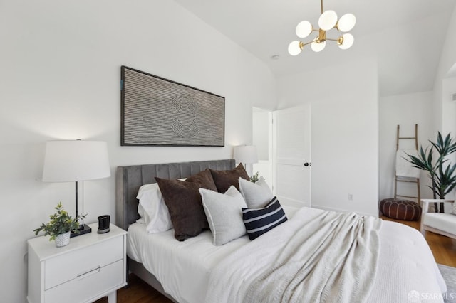 bedroom featuring vaulted ceiling, an inviting chandelier, and dark wood-style flooring