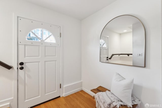 entryway featuring baseboards and light wood-style floors