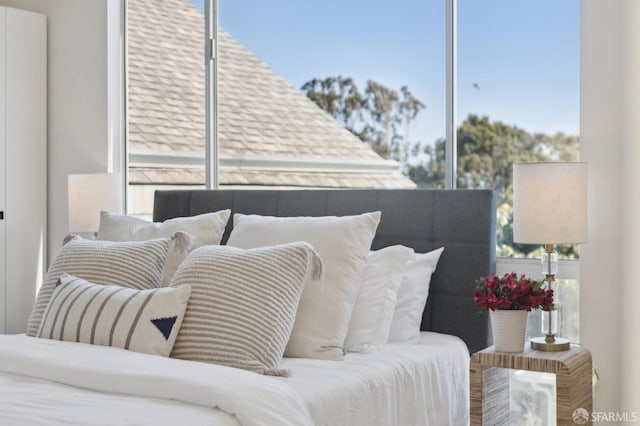 bedroom with multiple windows