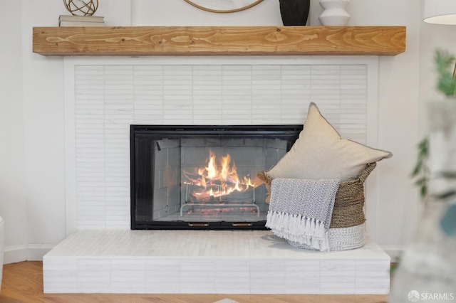 details with wood finished floors and a fireplace