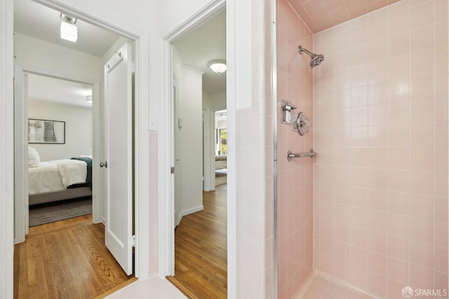 1944 15th Ave, San Francisco, CA 94116 - ensuite bathroom with a tile shower and wood finished floors
