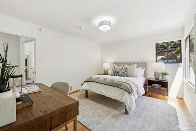 1944 15th Ave, San Francisco, CA 94116 - bedroom featuring wood finished floors, ornamental molding, and baseboards