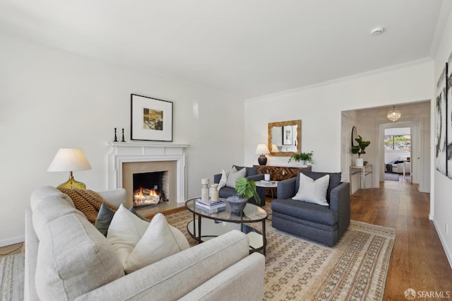1944 15th Ave, San Francisco, CA 94116 - living room featuring wood finished floors, a fireplace, ornamental molding, and baseboards