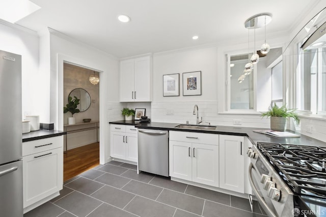 1944 15th Ave, San Francisco, CA 94116 - kitchen with stainless steel appliances, a sink, dark countertops, backsplash, and dark tile patterned floors