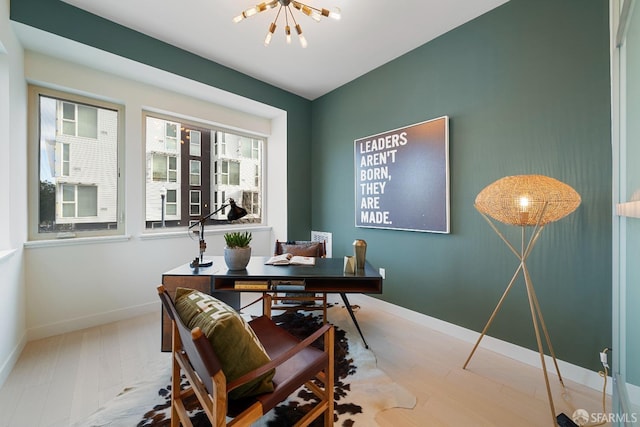 office area with a notable chandelier and wood-type flooring