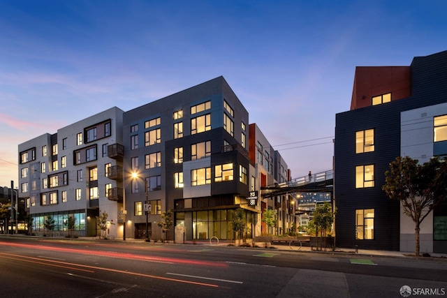 view of outdoor building at dusk