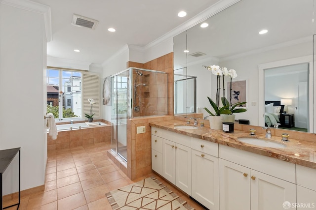 bathroom with vanity, crown molding, tile patterned floors, and independent shower and bath