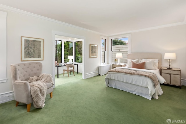 bedroom with crown molding, radiator, and carpet