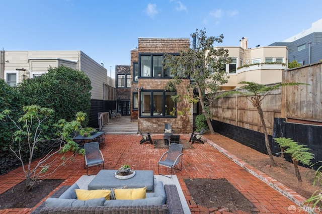 view of patio with an outdoor hangout area and a deck