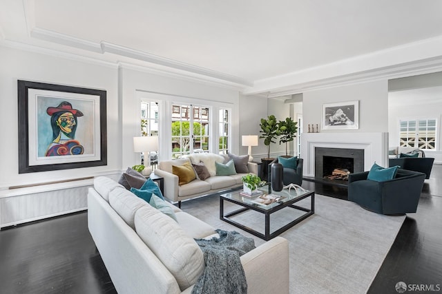 living room featuring wood-type flooring and crown molding