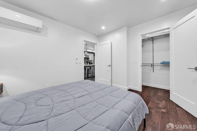 3014 Pine St Unit A, San Francisco, CA 94115 - bedroom with an AC wall unit, recessed lighting, wood finished floors, a closet, and a spacious closet
