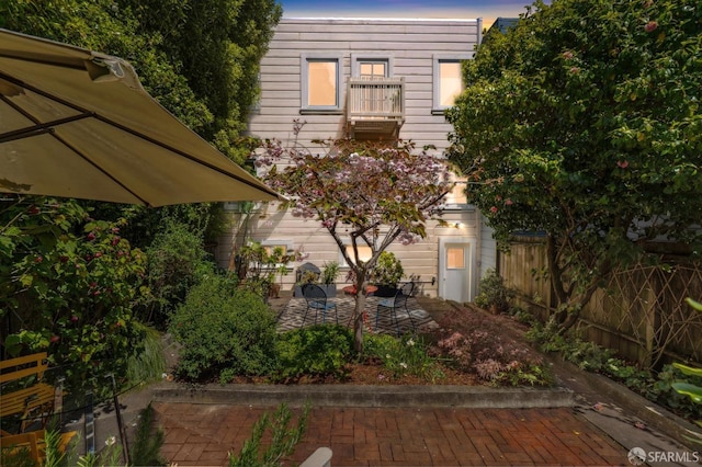 back of house with a patio area and fence