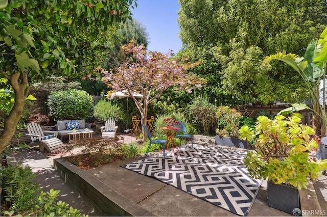 view of patio featuring fence