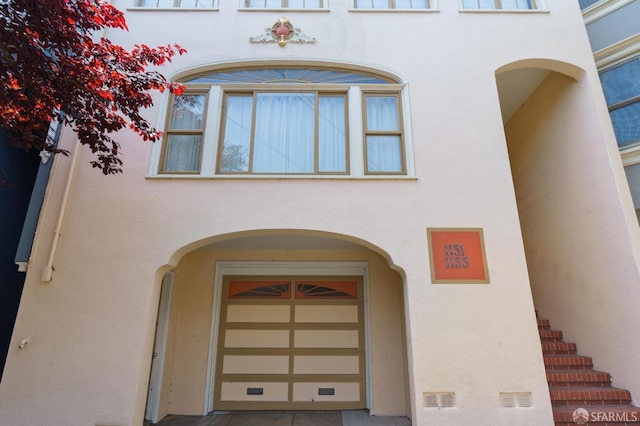 doorway to property with stucco siding