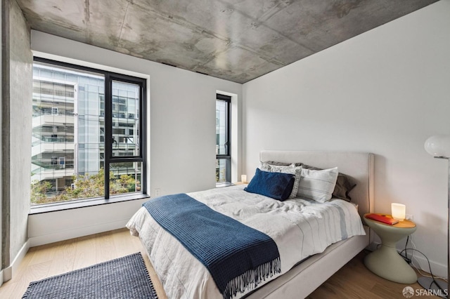 bedroom with wood-type flooring