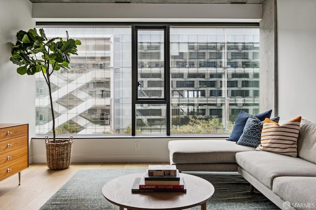 sitting room with hardwood / wood-style flooring