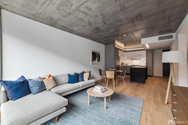 living room with light hardwood / wood-style floors