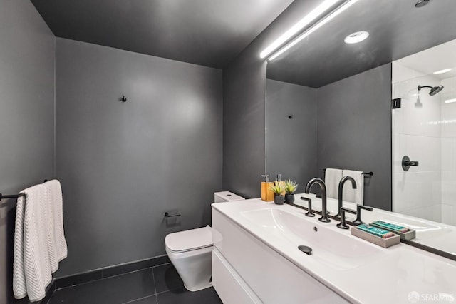 bathroom with tile patterned flooring, vanity, toilet, and an enclosed shower