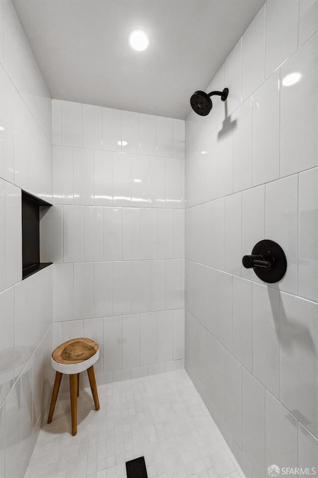 bathroom with tiled shower