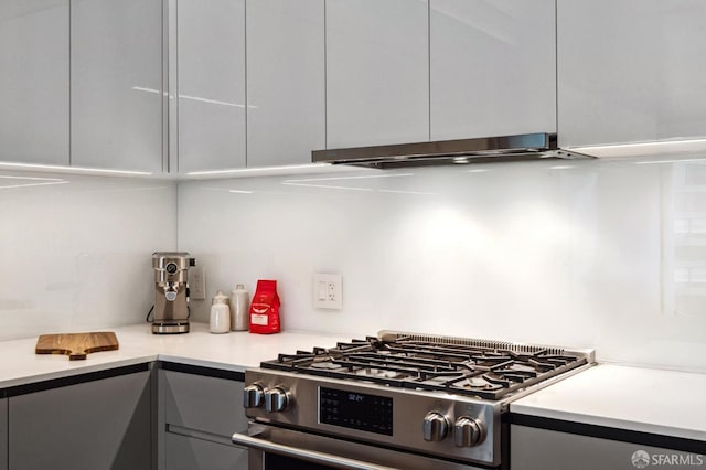 kitchen with gray cabinetry and stainless steel range with gas stovetop