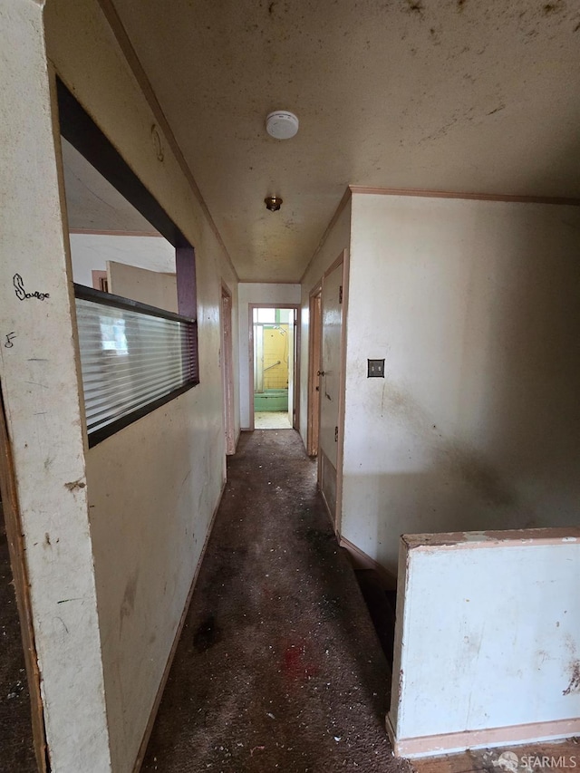 hall featuring baseboards