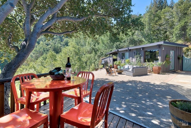 view of patio with outdoor lounge area and a wooden deck