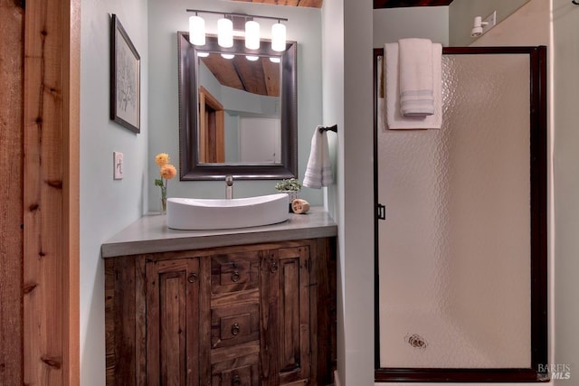 bathroom with vanity and an enclosed shower