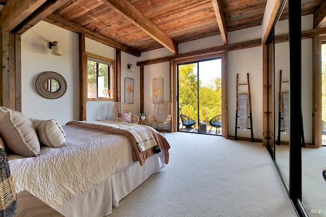 carpeted bedroom featuring beam ceiling, wooden ceiling, and access to outside