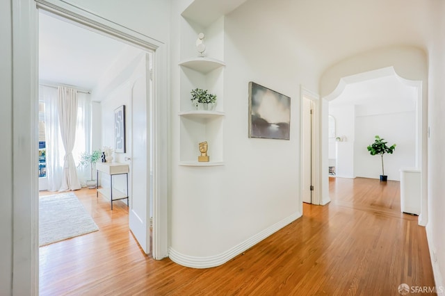 hall with light hardwood / wood-style flooring