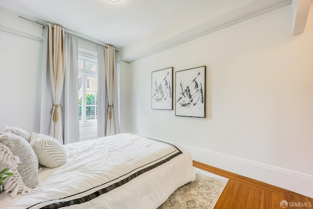 bedroom featuring wood-type flooring