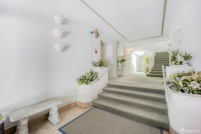 stairs featuring wood-type flooring