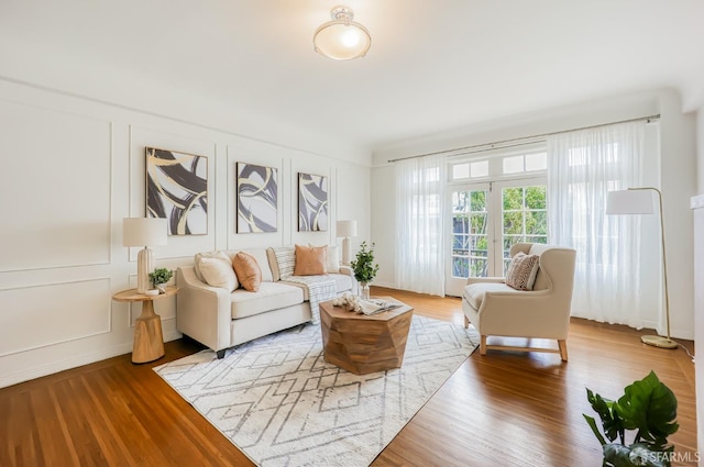 living room featuring hardwood / wood-style floors and french doors