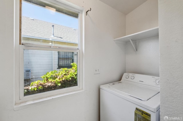 laundry area with a healthy amount of sunlight and washer / clothes dryer