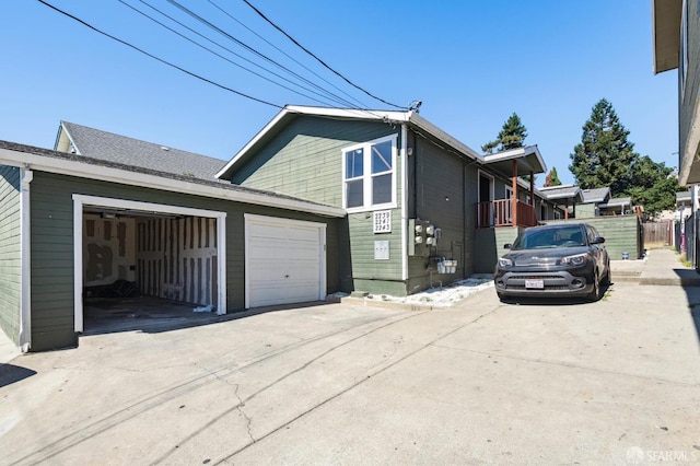 view of side of home with a garage