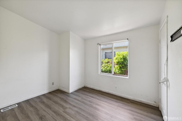 spare room featuring light hardwood / wood-style flooring