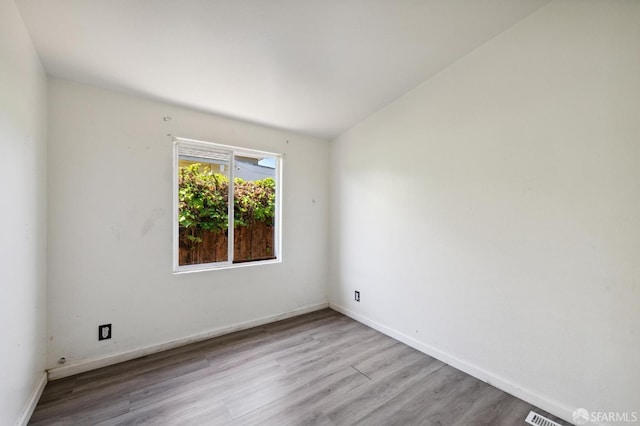 empty room with light wood-type flooring