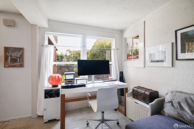 office area with a textured wall