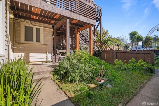 view of exterior entry with fence