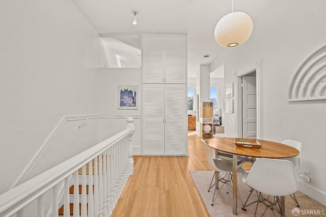 corridor with light wood finished floors