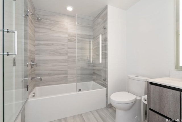 201 Folsom St Unit 2A, San Francisco, CA 94105 - full bathroom with toilet, vanity, enclosed tub / shower combo, recessed lighting, and wood finished floors
