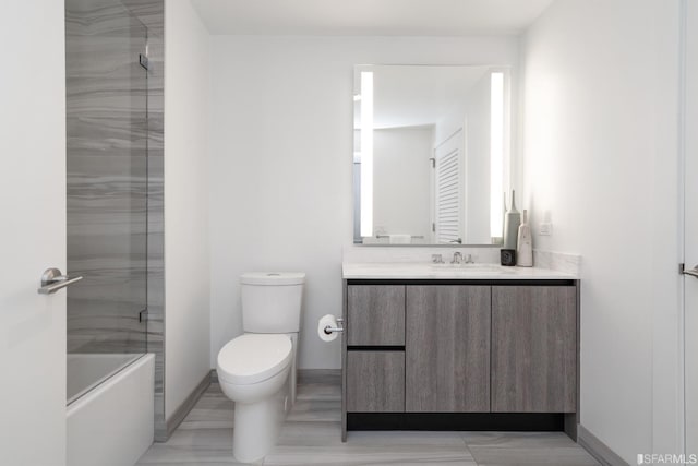 201 Folsom St Unit 2A, San Francisco, CA 94105 - bathroom with vanity, toilet, baseboards, and shower / bath combination